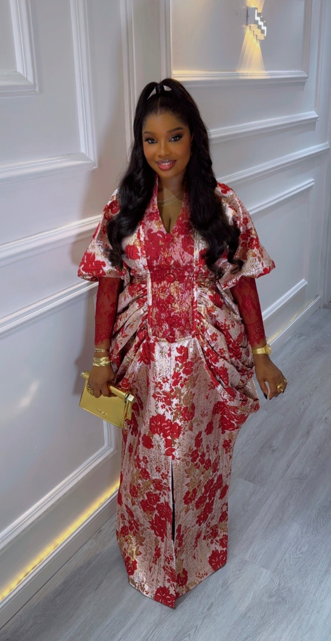 Amina Luxe Brocade Gown in red and gold floral fabric with pleated waist and puff sleeves