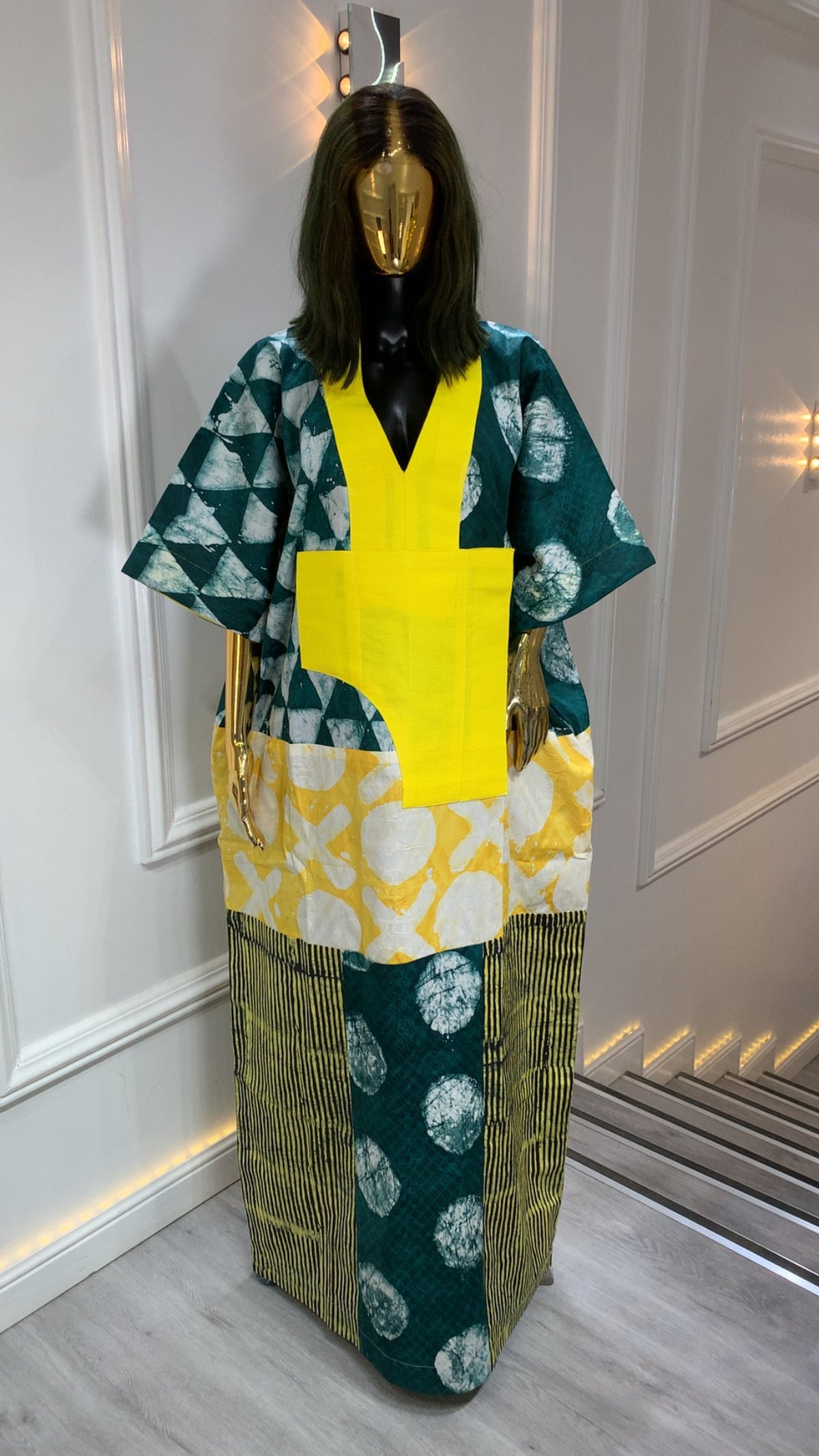 Luxury Adire long dress with handmade African print and modern color block design in green, white, and yellow.