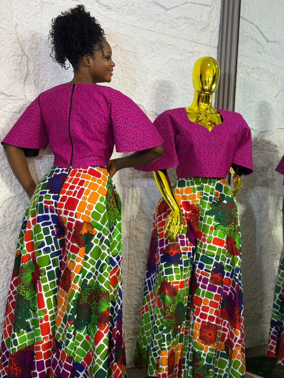 Umunde Women’s 2-Piece Ankara Set with multicolor wide-leg trousers and flared short sleeve pink blouse