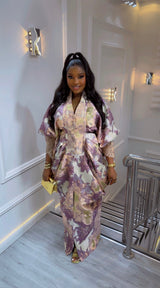 Amina Luxe Brocade Gown in purple with gold floral brocade, pleated waist, puff sleeves, and lace detailing for weddings and formal events