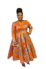 Umunde African Floral Brocade midi dress with cream base and olive floral patterns, fitted waist, and pleated skirt