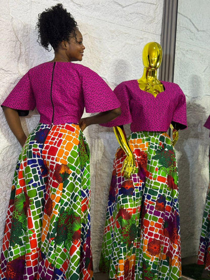 Umunde Women’s 2-Piece Ankara Set with multicolor wide-leg trousers and flared short sleeve pink blouse