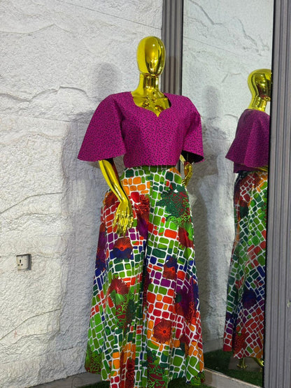 Umunde Women’s 2-Piece Ankara Set with multicolor wide-leg trousers and flared pink blouse